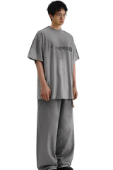 Masonprince Tag Drop Tee in gray worn by model with matching wide-leg pants