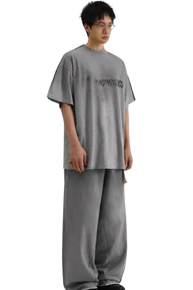 Masonprince Tag Drop Tee in gray worn by model with matching wide-leg pants