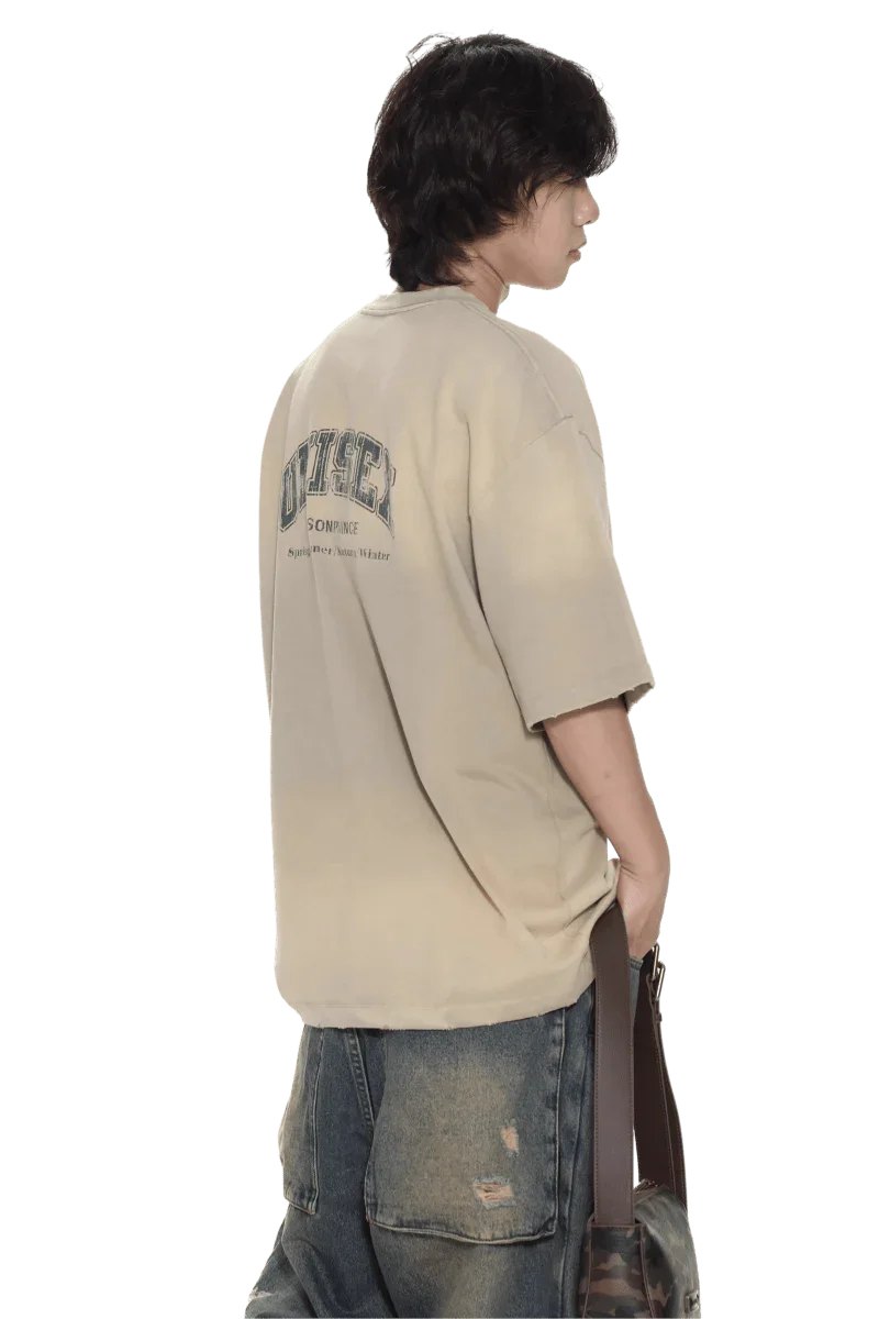 Masonprince beige unisex logo tee with printed design on back worn by model with jeans