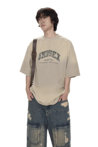 Masonprince unisex logo tee in beige worn with ripped denim jeans and crossbody bag