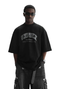 Masonprince unisex logo tee in black worn by model with sunglasses and ripped jeans