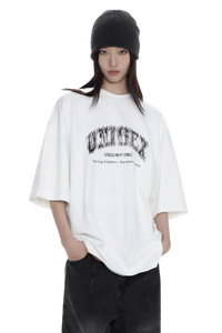 Masonprince unisex logo tee white oversized shirt with black text worn by model with black beanie