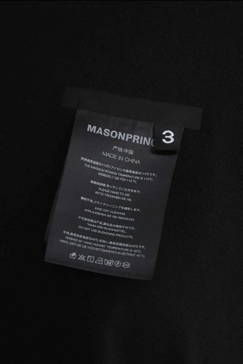 Masonprince WashTag Tee close-up of black fabric tag with care instructions and size 3 label