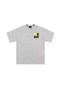 Gray MEDM Badge Tee featuring a bold logo design on the chest for casual style