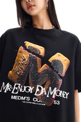 MEDM Big M Cookie Tee in black featuring colorful cookie graphic and bold text from Mr Enjoy Da Money