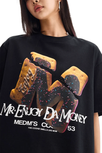 MEDM Big M Cookie Tee in black featuring colorful cookie graphic and bold text from Mr Enjoy Da Money
