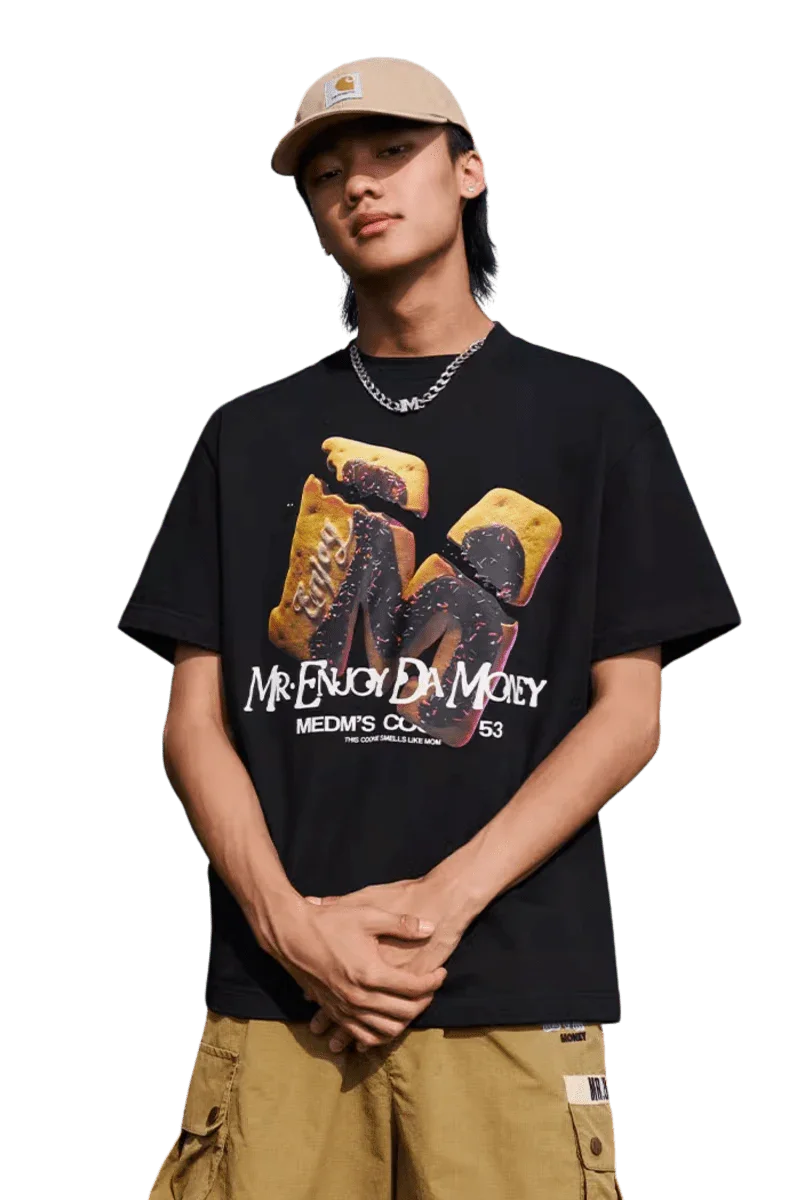 MEDM Big M Cookie Tee in black featuring vibrant graphic print by Mr Enjoy Da Money