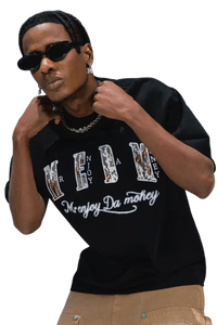 Man wearing black MEDM Burnt Laced Tee by Mr Enjoy Da Money with graphic text and stylish sunglasses