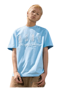 Young man wearing a light blue MEDM Burnt Laced Tee by Mr Enjoy Da Money with distressed lettering