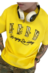 Yellow MEDM Burnt Laced Tee by Mr Enjoy Da Money worn with headphones and camo pants