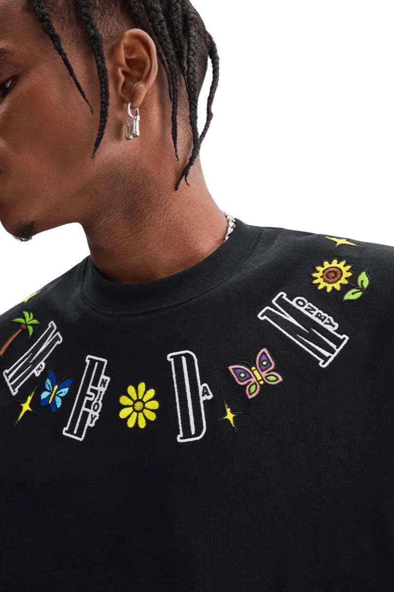 Close-up of black MEDM Butterfly Necklace Embroidery Tee by Mr Enjoy Da Money with colorful embroidered letters and butterfly design