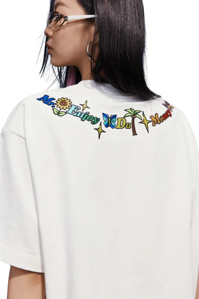 White MEDM Butterfly Necklace Embroidery Tee by Mr Enjoy Da Money with colorful embroidered text on back