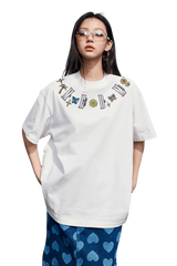 White MEDM Butterfly Necklace Embroidery Tee by Mr Enjoy Da Money worn with blue heart patterned pants