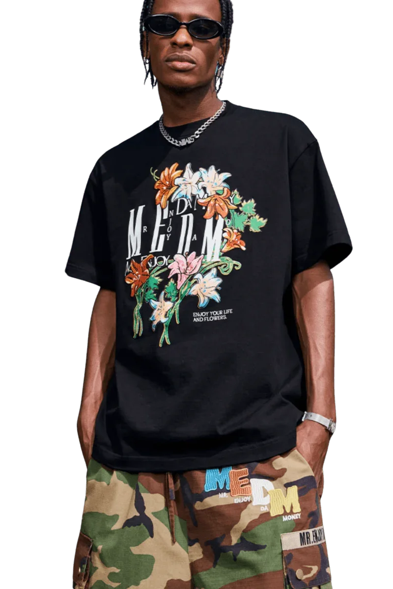 MEDM Curved Flower Print Tee in black featuring vibrant floral graphics and relaxed fit