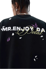 Black MEDM Falling Petals Embroidery Tee by Mr Enjoy Da Money with white petals and purple butterfly design on back