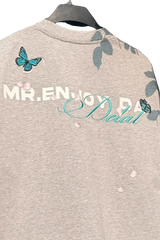 MEDM Falling Petals Embroidery Tee by Mr Enjoy Da Money with butterfly and petal embroidery on gray fabric