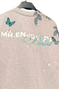 MEDM Falling Petals Embroidery Tee by Mr Enjoy Da Money with butterfly and petal embroidery on gray fabric