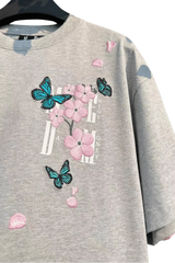 Gray MEDM Falling Petals Embroidery Tee with pink flower and blue butterfly designs by Mr Enjoy Da Money