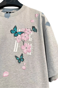 Gray MEDM Falling Petals Embroidery Tee with pink flower and blue butterfly designs by Mr Enjoy Da Money