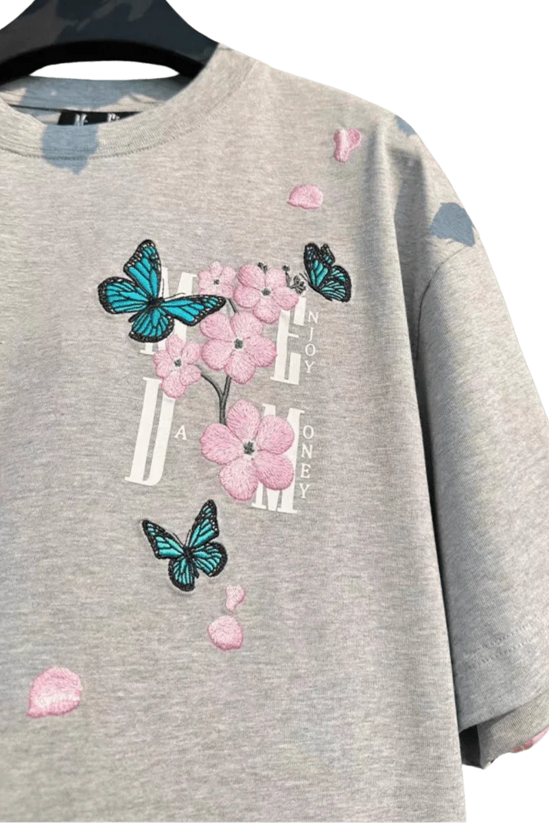 Gray MEDM Falling Petals Embroidery Tee with pink flower and blue butterfly designs by Mr Enjoy Da Money