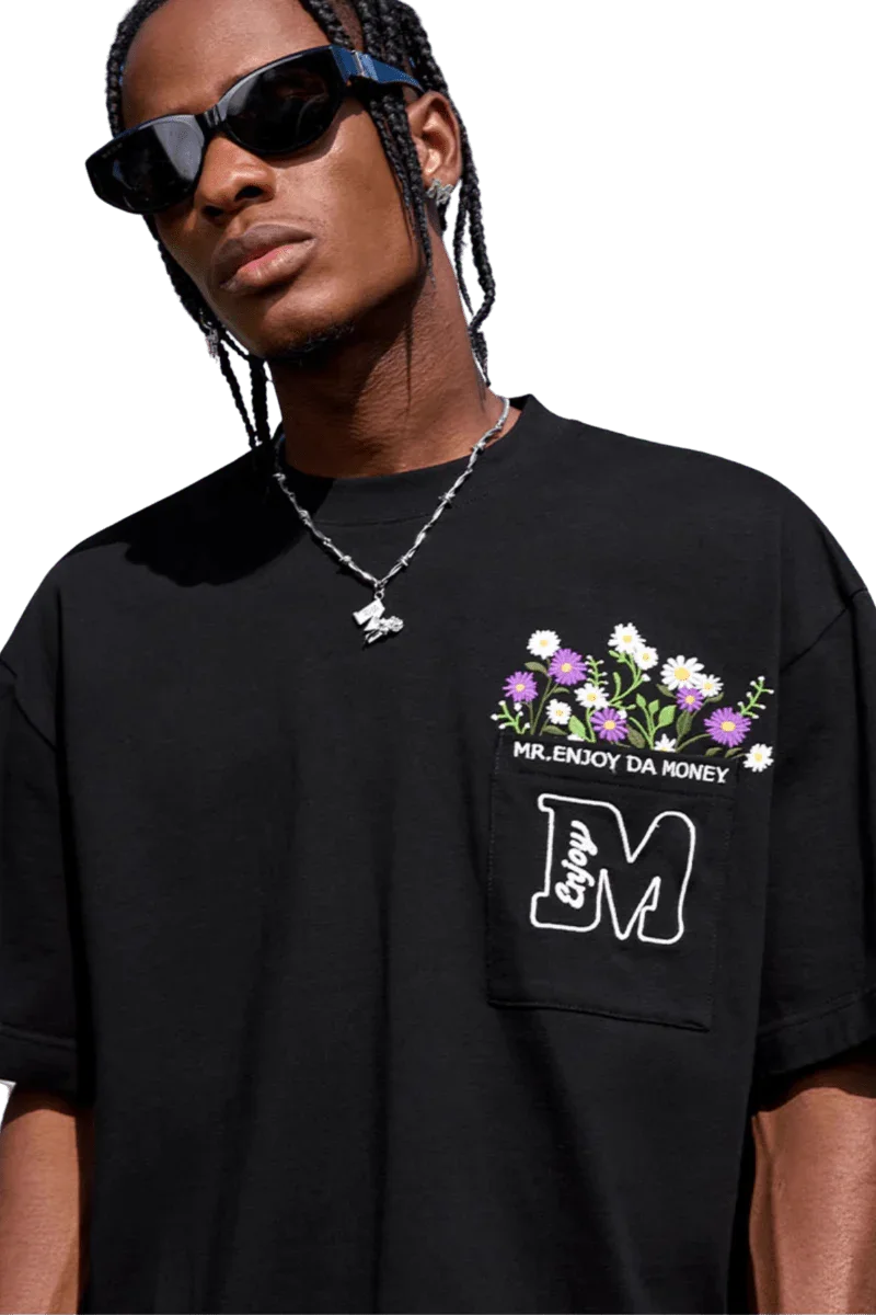 MEDM Flower Embroidery Pocket Tee in black featuring floral design and casual street style
