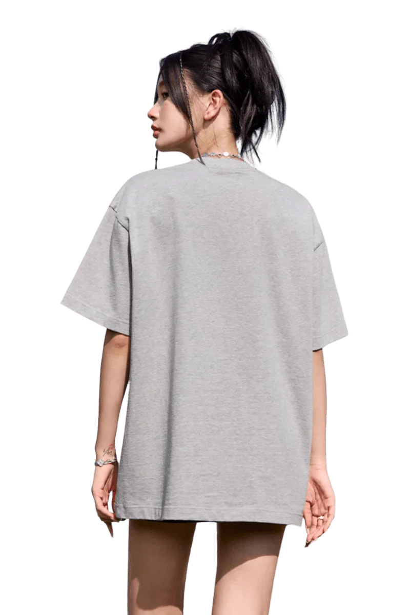 Back view of a grey MEDM Flower Embroidery Pocket Tee showcasing a relaxed fit and comfortable style.