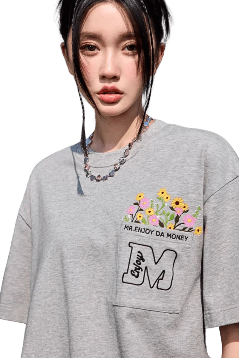 MEDM Flower Embroidery Pocket Tee in gray featuring vibrant floral design and relaxed fit