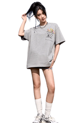 MEDM Flower Embroidery Pocket Tee in grey, featuring a colorful embroidered pocket design