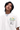 MEDM Flower Embroidery Pocket Tee in white featuring vibrant floral design and Mr Enjoy Da Money branding