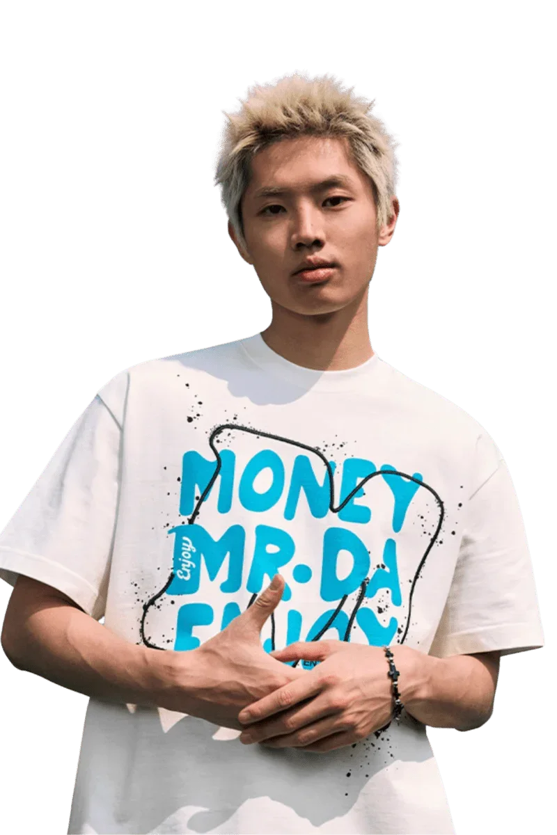 Young man wearing a MEDM Large M WireFrame Embroidery Tee featuring vibrant blue lettering on a white background