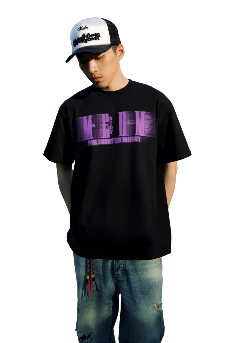 Model wearing black MEDM Phantom Contrast Tee with purple graphic and casual jeans