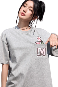 MEDM Pixelated Flower Pocket Tee by Mr Enjoy Da Money in light gray with pixelated flower design on the chest pocket