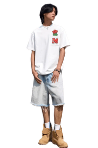 Young man wearing MEDM Pixelated Flower Pocket Tee in white with red flower and M logo