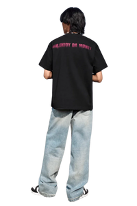 Back view of person wearing MEDM Smudged Floral Tee black shirt with Mr Enjoy Da Money logo and light blue jeans