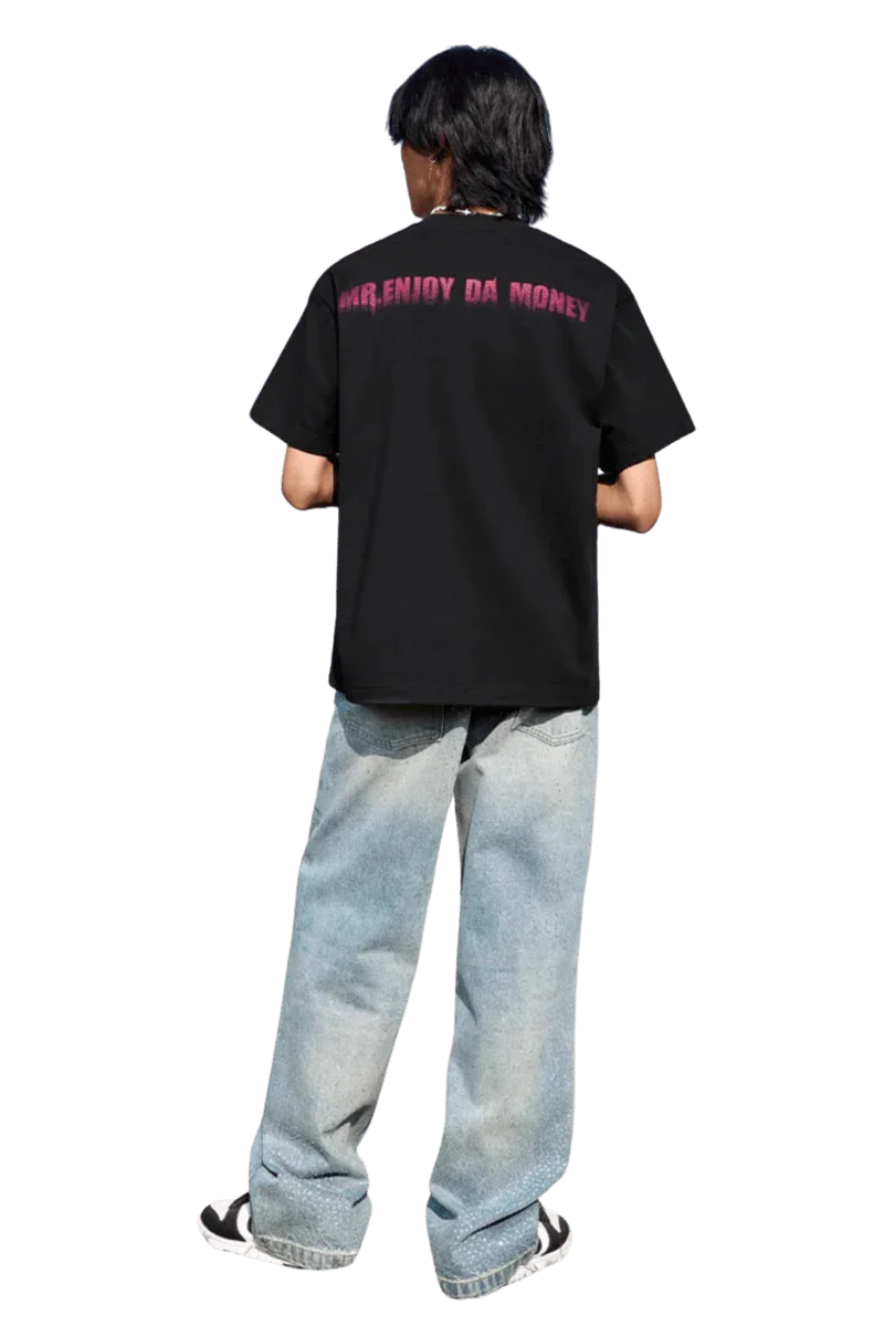 Back view of person wearing MEDM Smudged Floral Tee black shirt with Mr Enjoy Da Money logo and light blue jeans