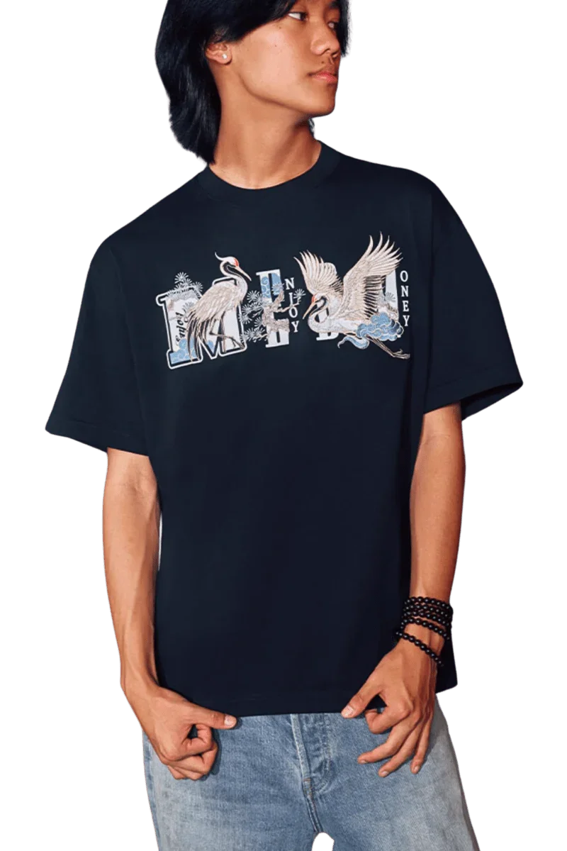 Model wearing MEDM SS24 Phoenix Embroidery Tee in black featuring vibrant embroidery design