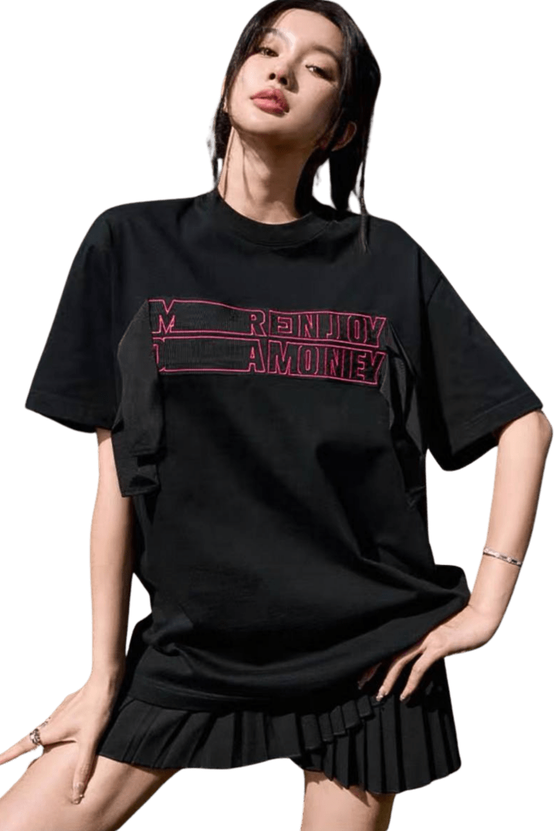 Model wearing a black MEDM SS24 Ribbon Embroidery Tee paired with a pleated skirt for a trendy look