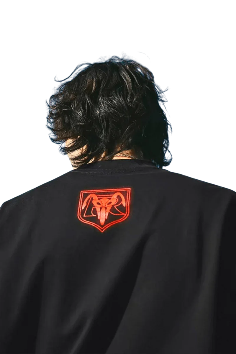 MEDM SS24 x Karmen Rider Tee featuring a bold logo print on the back of a black t-shirt