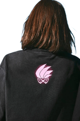 Black MEDM SS24 x Karmen Rider Tee featuring a striking pink logo design on the back