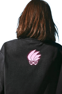 Black MEDM SS24 x Karmen Rider Tee featuring a striking pink logo design on the back