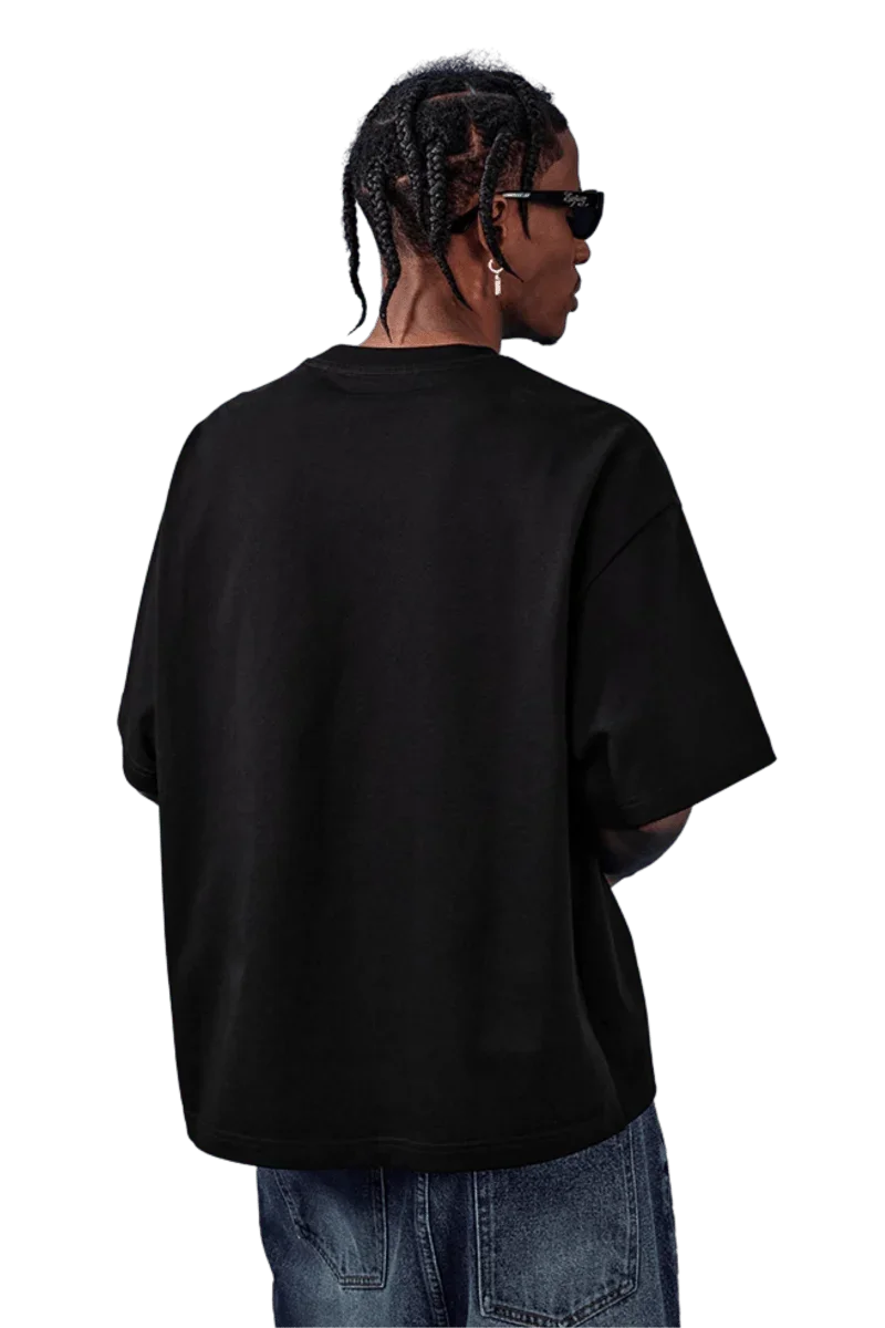 Back view of a black MEDM SS25 Basic Embroidery Tee showcasing a relaxed fit and stylish design