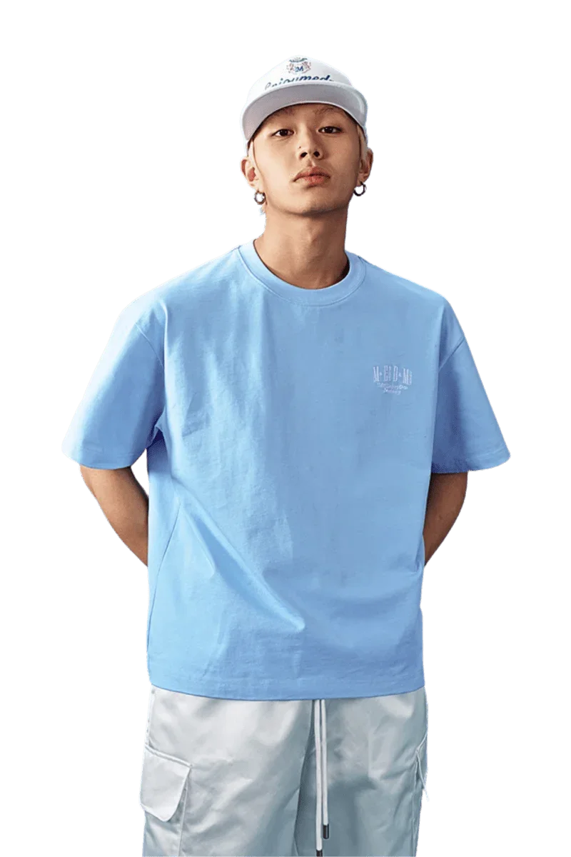 Light blue MEDM SS25 Basic Embroidery Tee showcasing a casual style for everyday wear