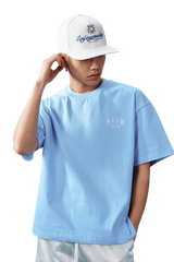 MEDM SS25 Basic Embroidery Tee in Light Blue with a Casual Fit and Stylish Cap