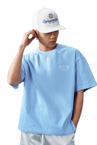 MEDM SS25 Basic Embroidery Tee in Light Blue with a Casual Fit and Stylish Cap