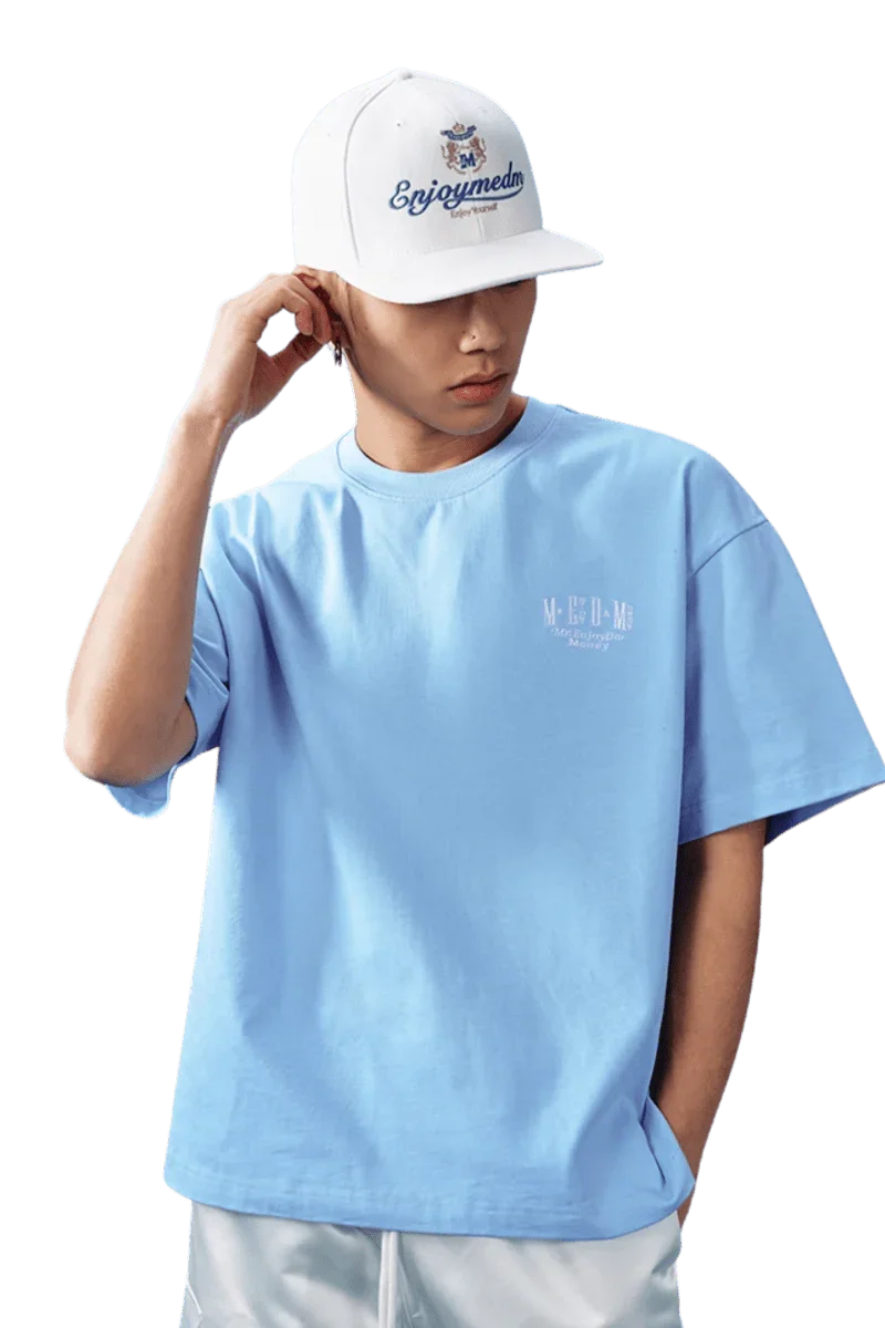 MEDM SS25 Basic Embroidery Tee in Light Blue with a Casual Fit and Stylish Cap