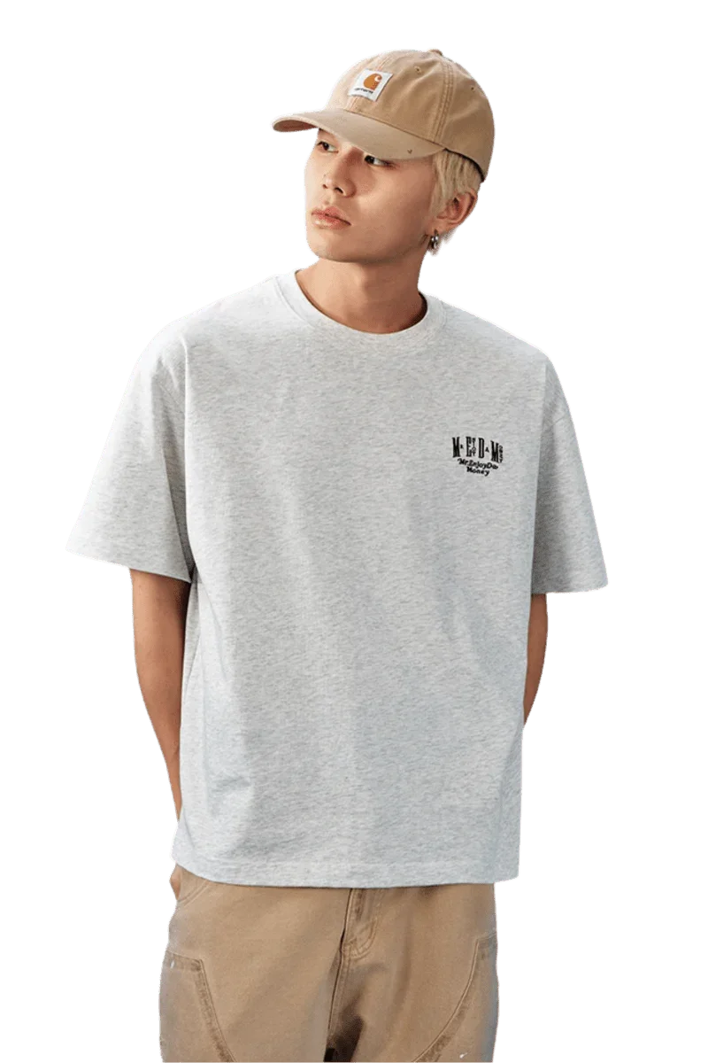 Stylish gray MEDM SS25 Basic Embroidery Tee featuring a minimalist logo for casual wear