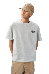 Stylish gray MEDM SS25 Basic Embroidery Tee featuring a minimalist logo for casual wear