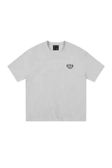 MEDM SS25 Basic Embroidery Tee in light gray featuring a simple logo design