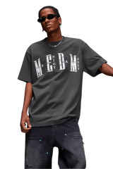 Street style model wearing MEDM SS25 Basic Gem Series Tee in gray with bold lettering for a trendy look