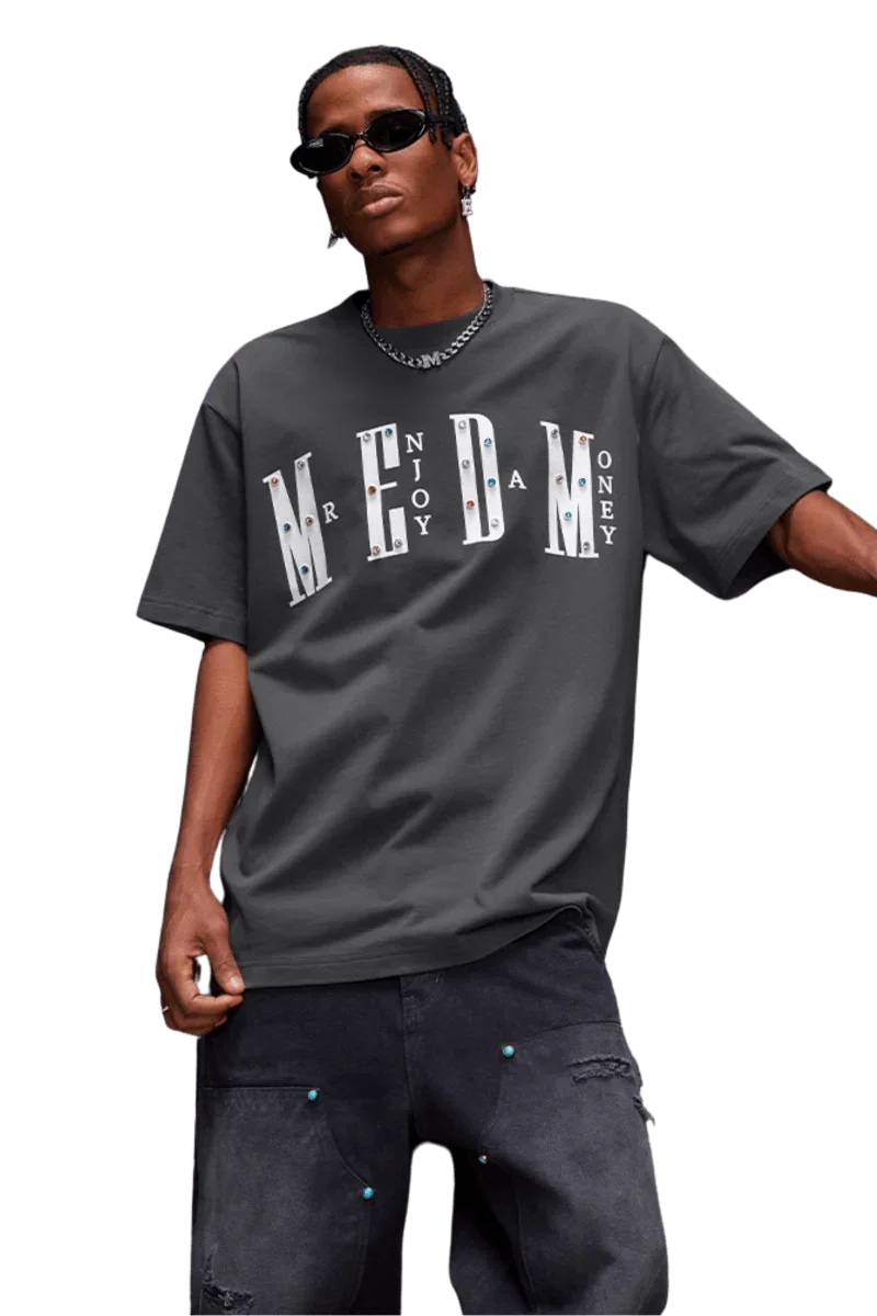 Street style model wearing MEDM SS25 Basic Gem Series Tee in gray with bold lettering for a trendy look